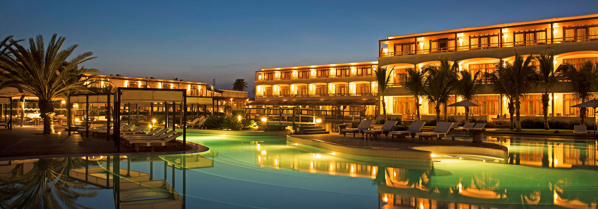 Pool And Hotel By Night