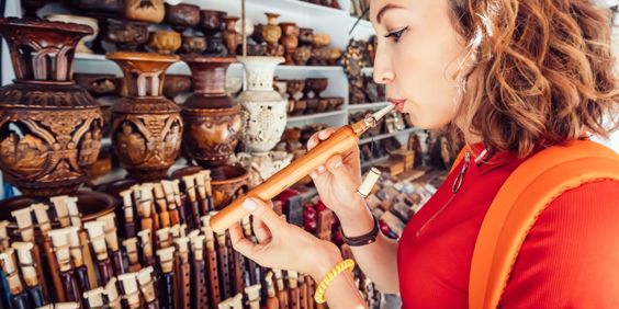 Armenia Yerevan Woman Inspects A Duduk Traditional Armenian Musical Wooden Instrument